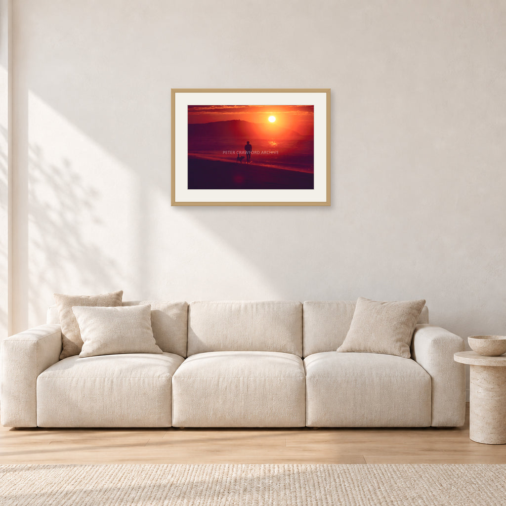 Winter Sun, Collaroy by Peter Crawford — 60 × 40 cm, hayseed frame with white mat, shown in a light minimalist living room.