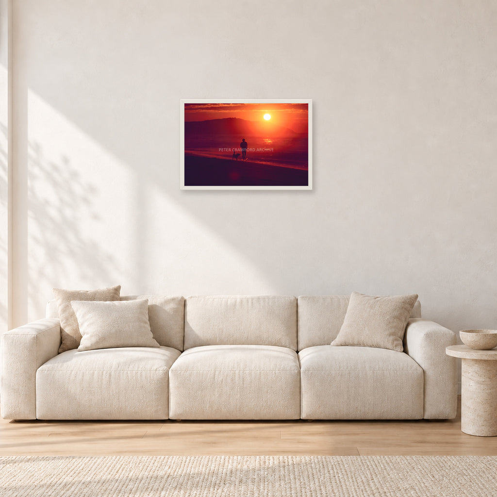 Winter Sun, Collaroy by Peter Crawford — 60 × 40 cm, white frame, shown in a light minimalist living room.