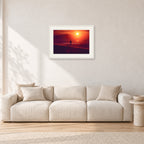Winter Sun, Collaroy by Peter Crawford — 60 × 40 cm, white frame with white mat, shown in a light minimalist living room.