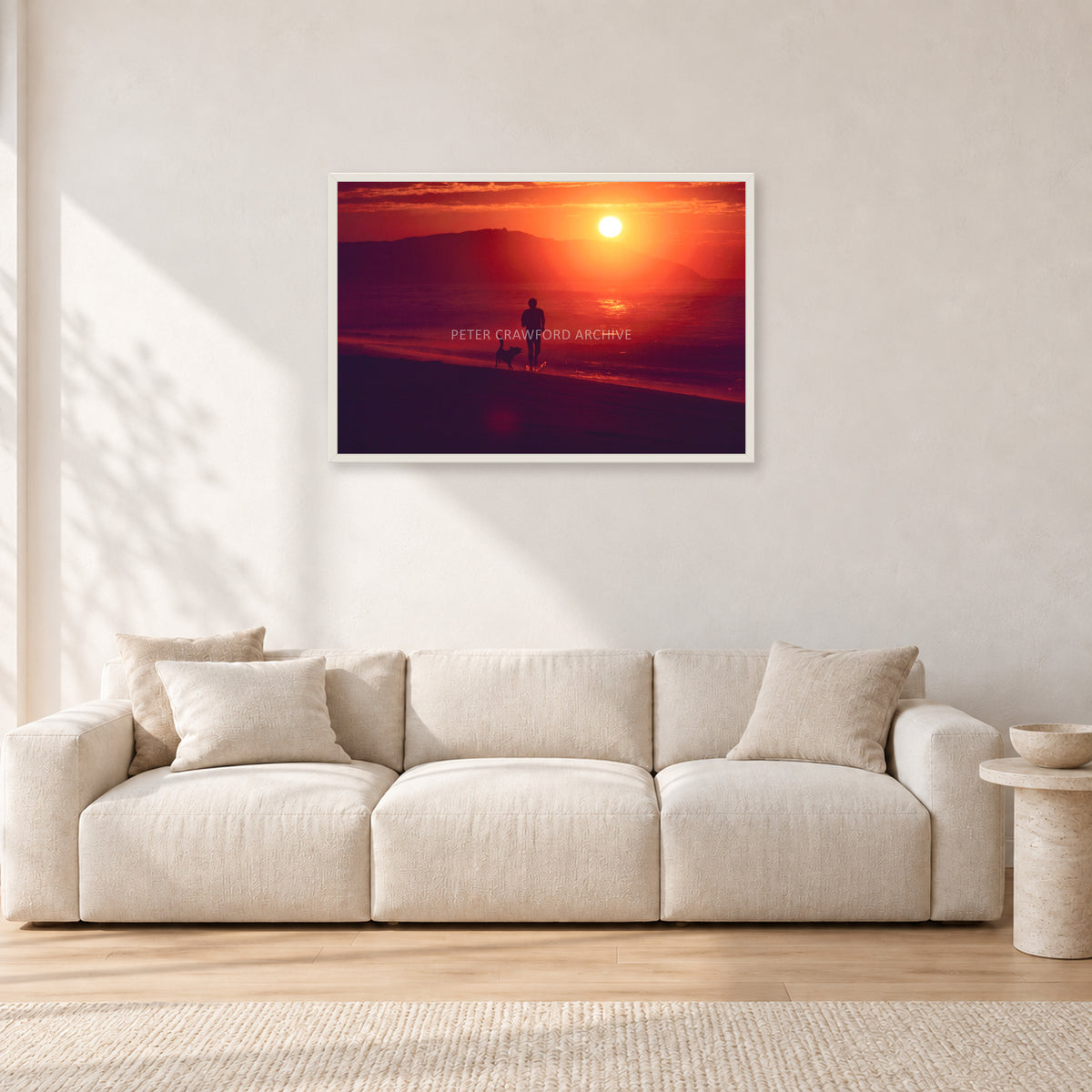 Winter Sun, Collaroy by Peter Crawford — 90 × 60 cm, white frame, shown in a light minimalist living room.